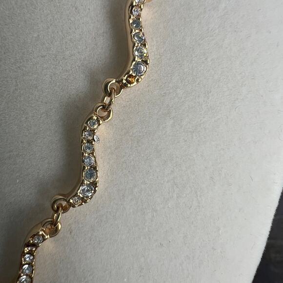 Signed Swarovski Crystal Elegant Gold Tone Wave Necklace missing one small stone - Picture 4 of 7